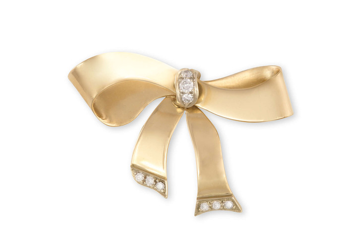 A GOLD AND DIAMOND BROOCH...