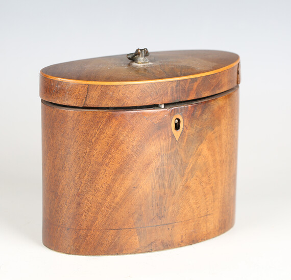 A George III mahogany oval tea caddy with hinged lid, width 15.5cm (faults).