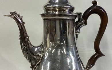 A George III silver coffee pot.