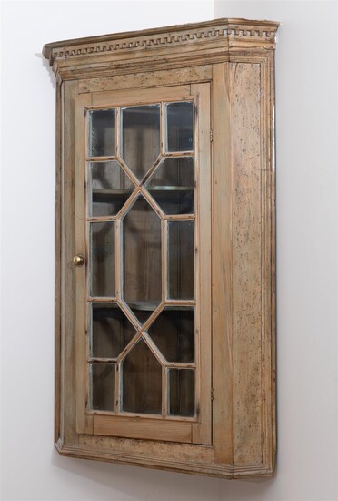 A Georgian pine astraglazed corner cabinet of small proportions, with...