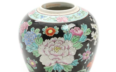 A Japanese Famille Noire porcelain jar, decorated in enamel colours with flowers...