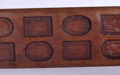 A LARGE 19TH CENTURY WOODEN BISCUIT MOULD, formed with