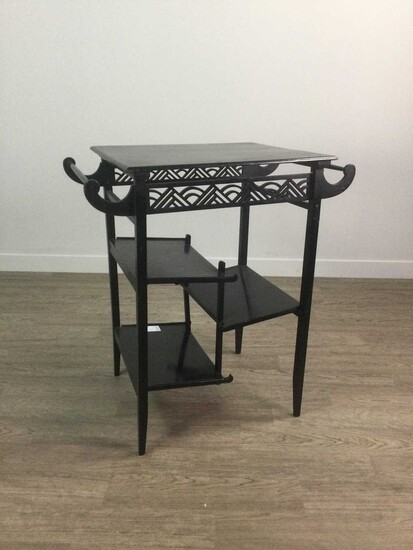 A LATE 19TH CENTURY EBONISED TIERED OCCASIONAL TABLE IN THE MANNER OF E. W. GODWIN