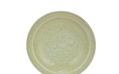 A LONGQUAN CELADON CARVED AND MOULDED 'LOTUS' DISH Late Ming...