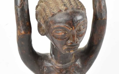 A Lega, Democratic Republic of Congo, figure modelled with arms...
