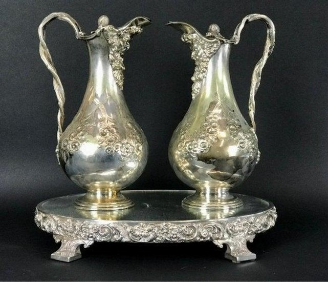 A PAIR OF SILVER PLATED PITCHERS AND PLATEAU