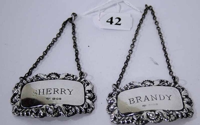 A PAIR OF STERLING SILVER DECANTER LABELS