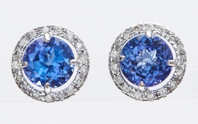 A PAIR OF TANZANITE AND DIAMOND EARRINGS-Each earring set with a round cut tanzanite weighing 3.60cts, surrounded by round brilliant...