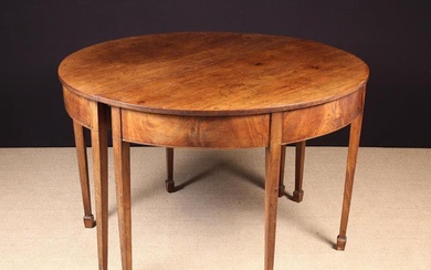 A Pair of Georgian Mahogany Demi-lune Tables. The friezes edged with stringing of ebony & boxwood in