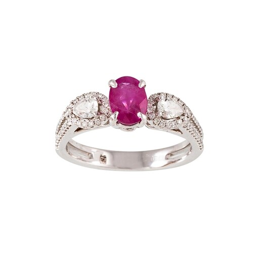 A RUBY AND DIAMOND THREE STONE RING, the oval ruby to pear s...