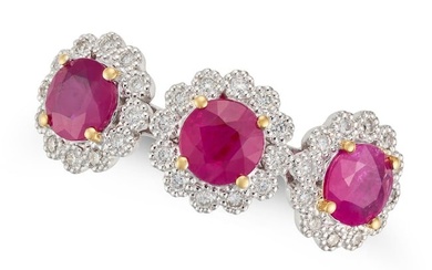 A RUBY AND DIAMOND TRIPLE CLUSTER RING set with three round cut rubies in clusters of round cut