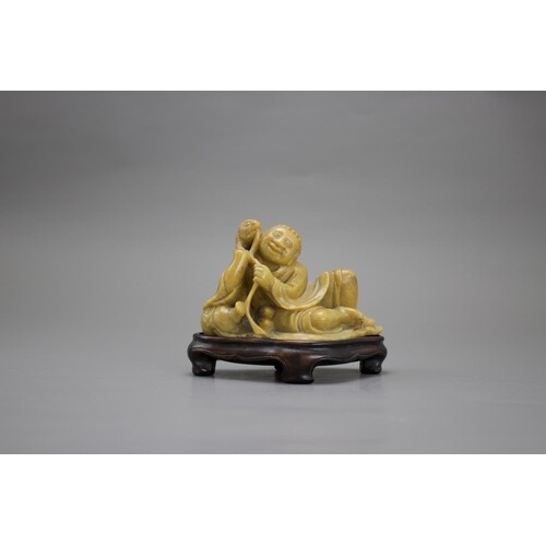 A Reclining Soapstone Figure of Liuhai, c. 1900L: 11.2cm A ...
