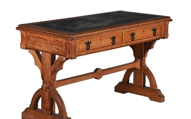A Reformed Gothic oak and inlaid writing table