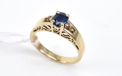 A SAPPHIRE RING WITH DIAMOND DETAIL STAMPED 9K, SIZE N