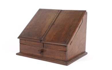 A Victorian oak stationary box. WIth hinged double doors and fitted interior above a lower drawer, on moulded plinth base, L42.4cm x D32cm x H32cm