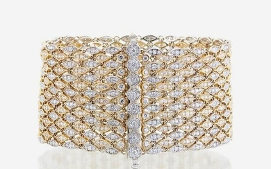 A bicolor fourteen karat gold and diamond bracelet