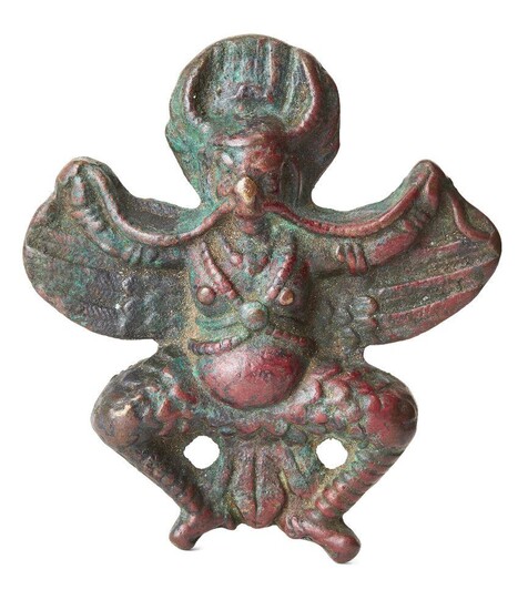 A bronze plaque of Garuda, Tibet or Nepal, 17th century or earlier, the horned deity depicted with wings outstretched, his feather legs bent at the knees, the reverse plain, 10.1cm. high Provenance: Private Collection Oliver Hoare (1945-2018)