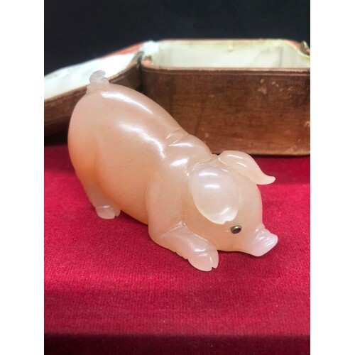 A carved hardstone figure of a pig. Comes with original box....