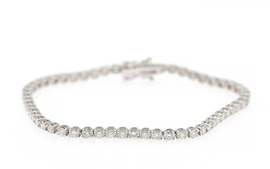 A diamond bracelet set with numerous brilliant-cut diamonds weighing a total of app. 4.75 ct., mounted in 14k white gold. W. app. 3 mm. L. 19,5 cm.