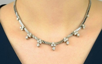 A diamond cluster fringe necklace. Estimated total