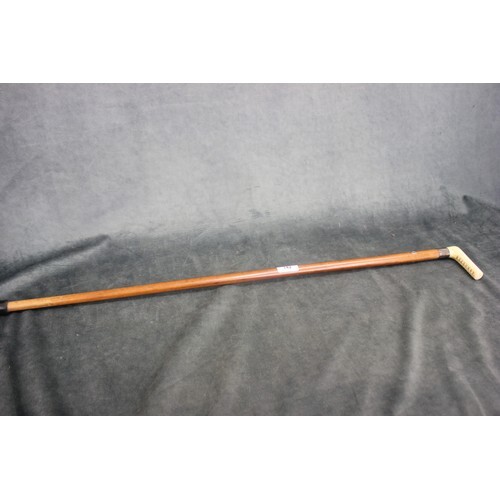 A fruitwood walking cane, with bone handle and silver-plated...