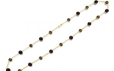 Amendment: Please note that the image for this lot is incorrectA garnet and smoky quartz necklace, composed of a line of alternate garnet and smoky quartz beads with fancy chain links between, length 59.0cm