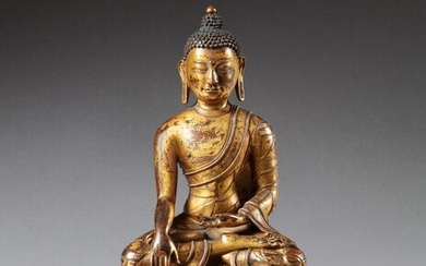 A gilt-copper alloy figure of a Buddha Tibet, 15th-16th century | 西藏 十五至十六世紀 鎏金銅合金佛坐像