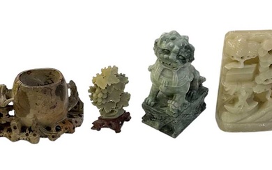 A group of Chinese carved hardstone and soapstone figures including...
