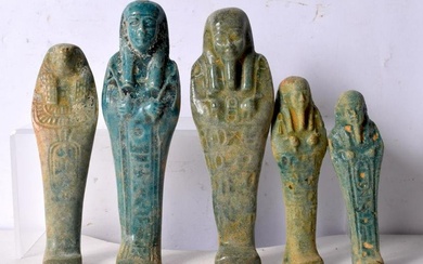 A group of Egyptian glazed pottery Sarcophagus figures. Largest 16cm (5).