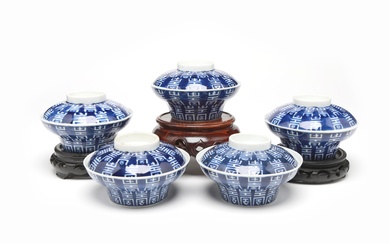 A group of blue and white porcelain covered bowls each painted with Shou characters on a blue ground