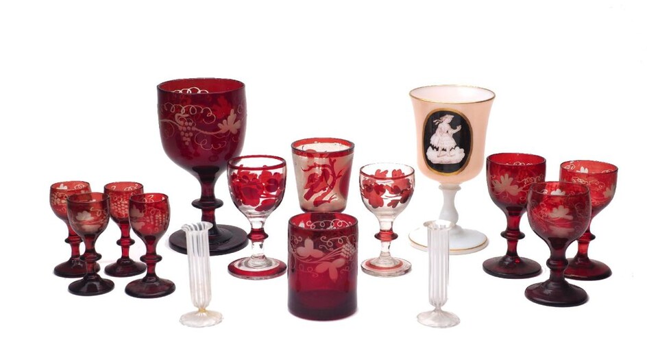 A group of coloured glassware, 19th century, to include an opaline goblet of bell form bowl with printed and and painted medallion of a lady, on a ringed baluster stem, with gilt rims, 14.8cm high, together with a selection of red drinking glasses...