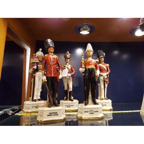 A group of five porcelain soldier figurines