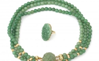 A jade necklace and a 14 karat gold jade ring. Composed of three strands of beads amongst gold ribbed spacer beads. Featuring a floral carved jade set clasp, similar to the carving of the ring. Gross weight: 144.2 g.