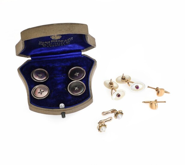 SOLD. A jewellery set comprising four buttons, a pair of cufflinks and two pair of...
