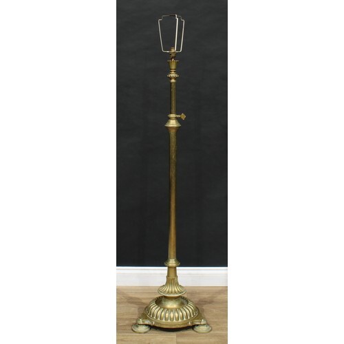 A late 19th century brass telescopic standard lamp, lotus sc...
