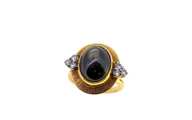 A late 20th century 18ct gold star sapphire and diamond ring