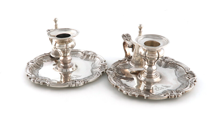 A matched pair of William IV and Victorian silver chamber sticks