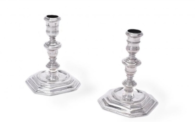 A matched pair of cast Britannia standard silver candlesticks