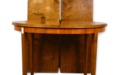 A mid-20th century mahogany dining table.