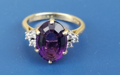 A modern amethyst & diamond set 18ct gold ring....