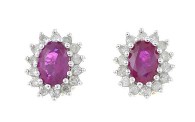 A pair of 9ct gold ruby and brilliant-cut diamond cluster stud earrings.
