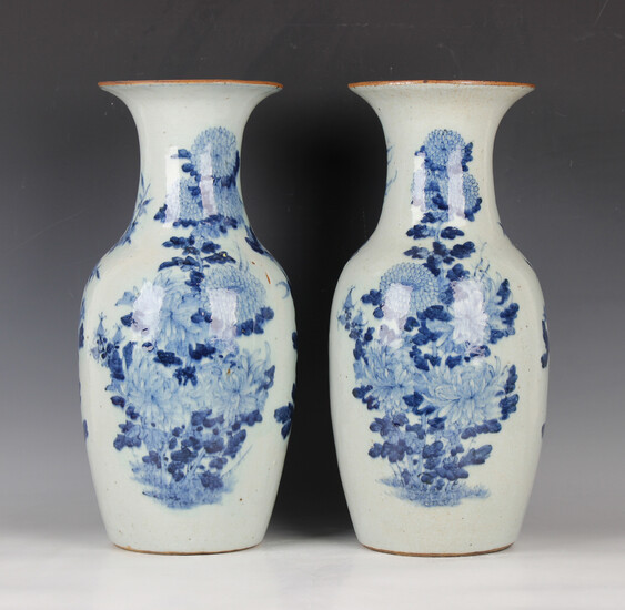 A pair of Chinese blue and white porcelain vases, late 19th/early 20th century, each shouldered tape