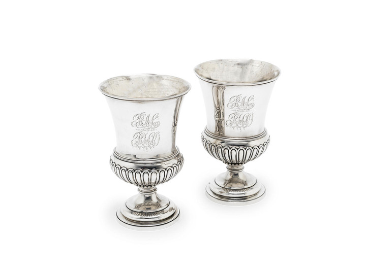 A pair of George III silver goblets