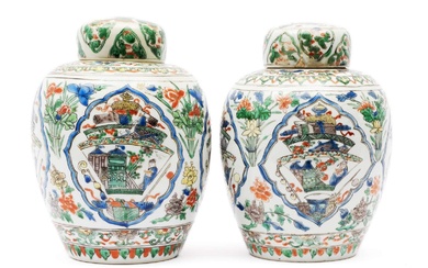 A pair of famille verte lidded vases