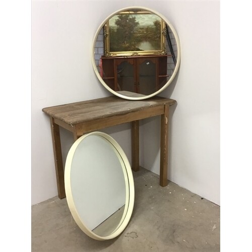 A pair of mid century round mirrors with early plastic frame...