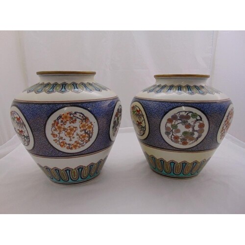 A pair of oriental porcelain vase of baluster form decorated...