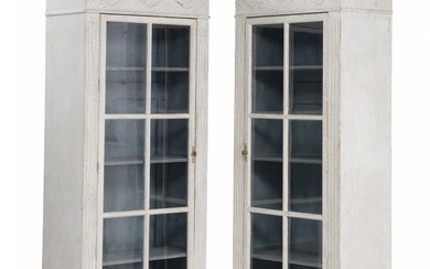 A pair of painted Swedish display cabinets. Gustavian style, partly 19th century....