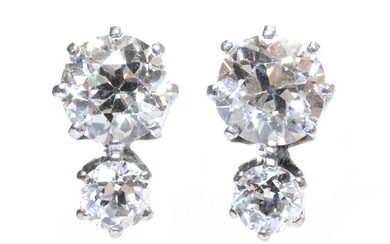 A pair of two stone diamond stud earrings