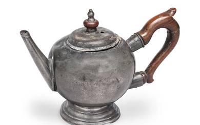 A rare George II pewter bullet-shaped touchmarked teapot, circa 1730