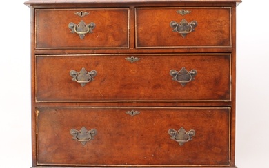 A reproduction Georgian-style burr walnut and yew chest of d...